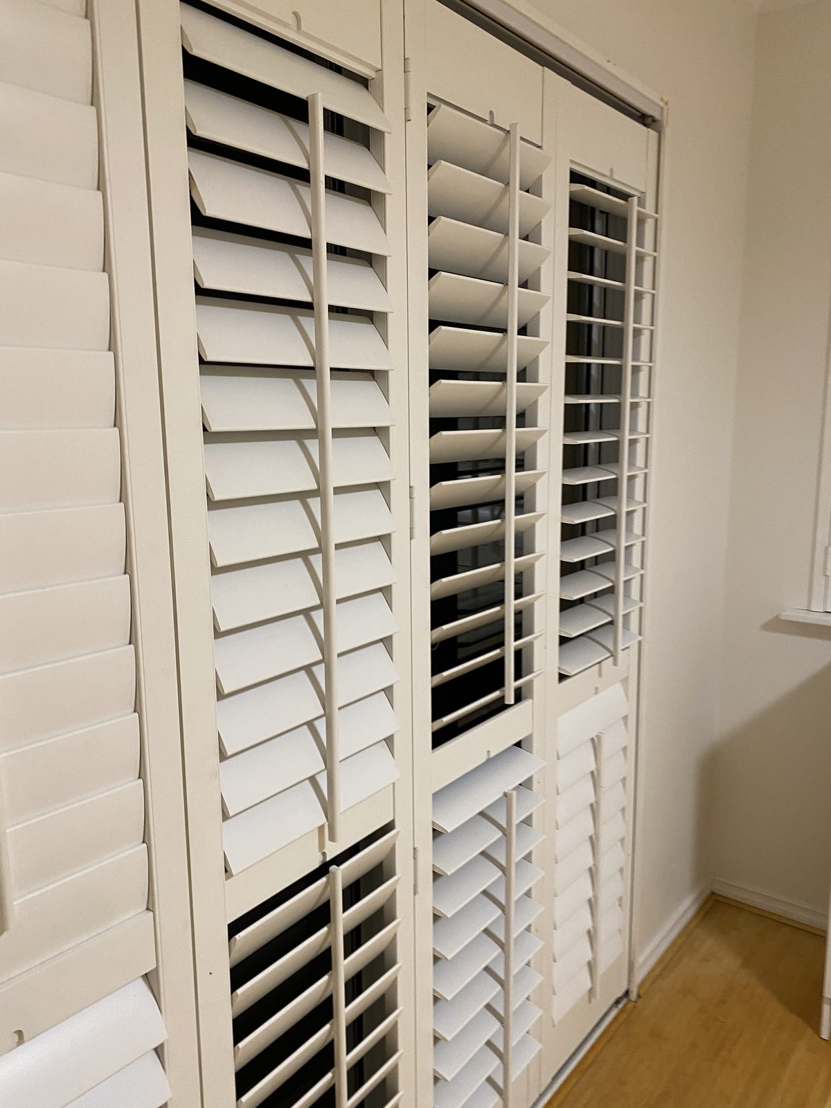 White plantation shutters cleaned slat by slat after an end of lease clean in Claremont